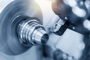 Part being fabricated on a CNC lathe.