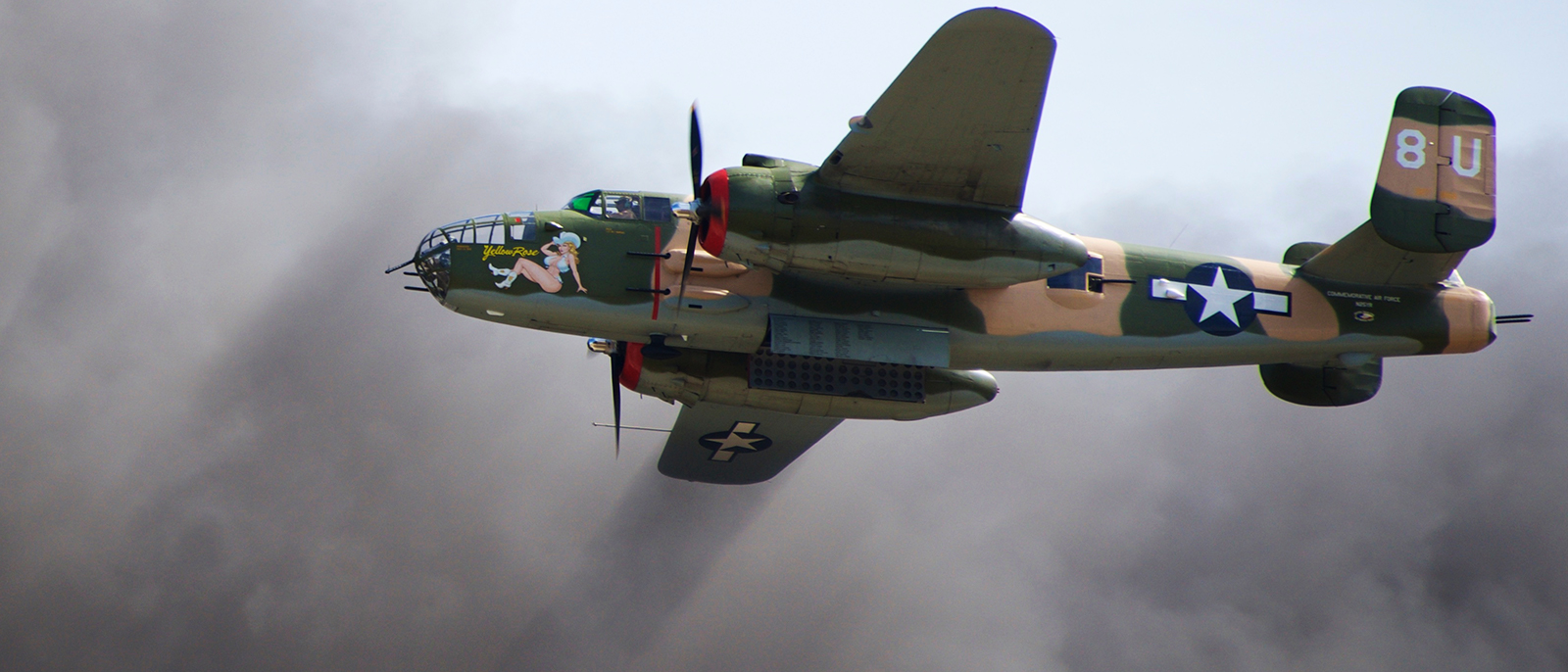 Commemorative Air Force, Central Texas Wing's 1944 B-25J Yellow Rose, San Marcos, TX Flying through smoke during the 'Tora Tora Tora' Pearl Harbor Attack Re-enactment - November 1st, 2014