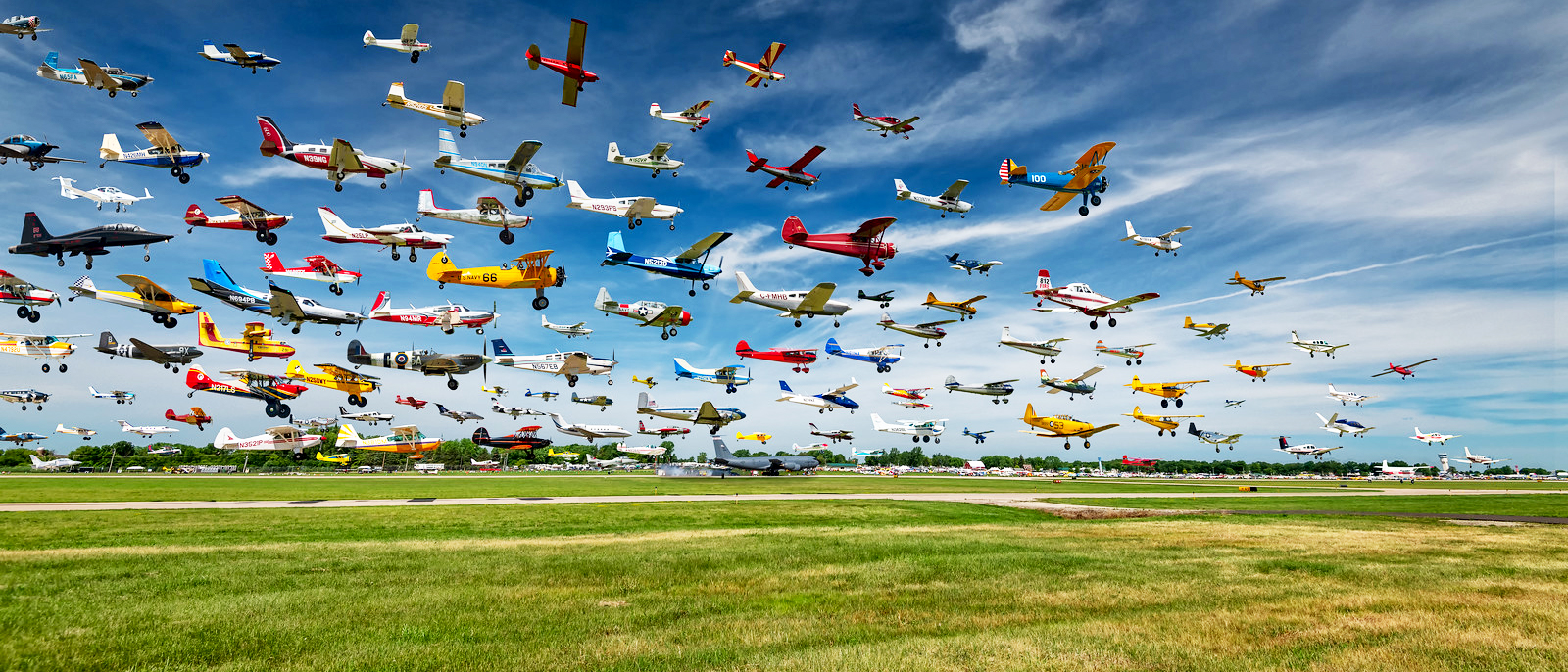 Composite of many photos taken of arrivals over a four hour period on the Sunday prior to Airventure 2019 Organized Chaos used with license from Hal Davis Photography